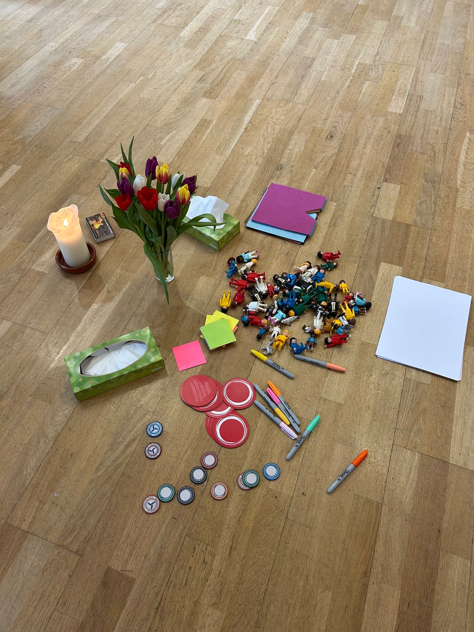 Workshop materials arranged on a wooden floor